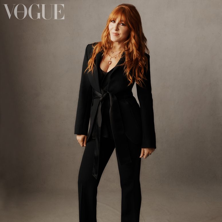 Image may contain: Clothing, Apparel, Suit, Coat, Overcoat, Human, Female, Person, Dress, Charlotte Tilbury, and Woman
